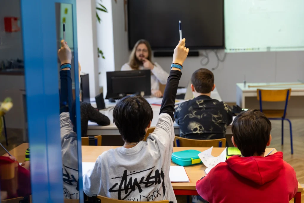 Students collaborating during a classroom activity at the British International School of Cracow (BISC)